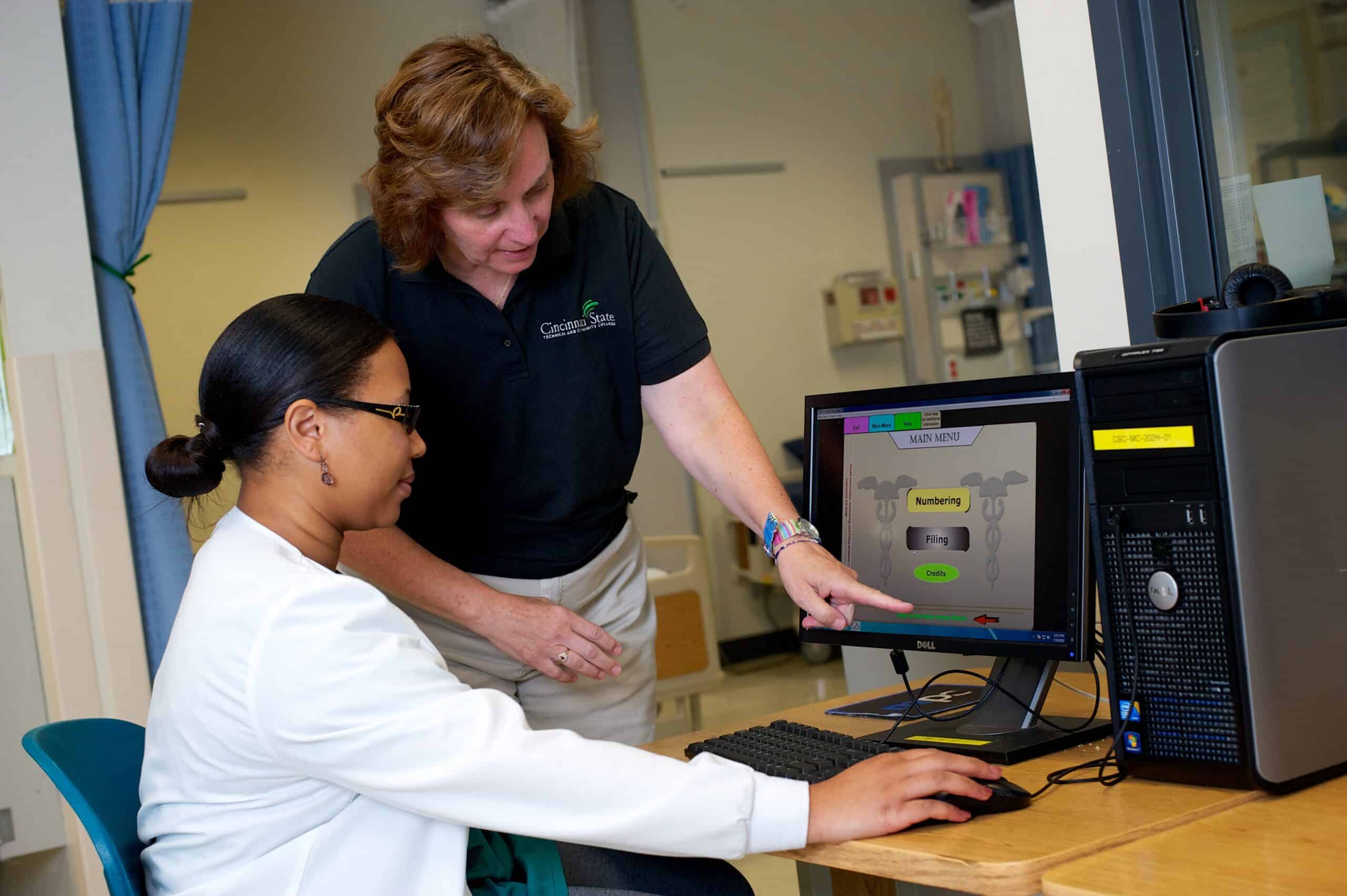 image depicting a professor, teacher, instructor, helping a student