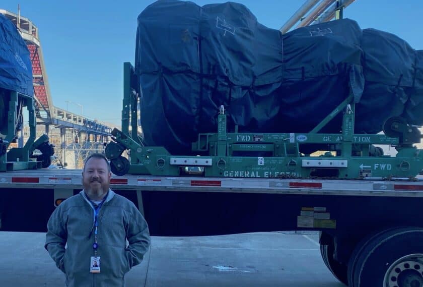 Carl Leugers standing in front of truck with donated jet engines