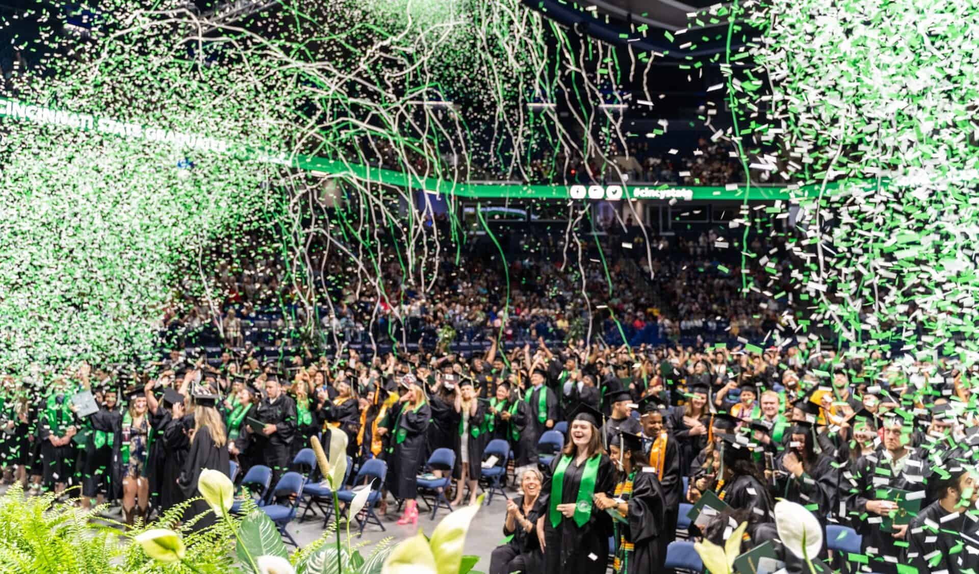 confetti falling on graduates at the end of the Commencement ceremony