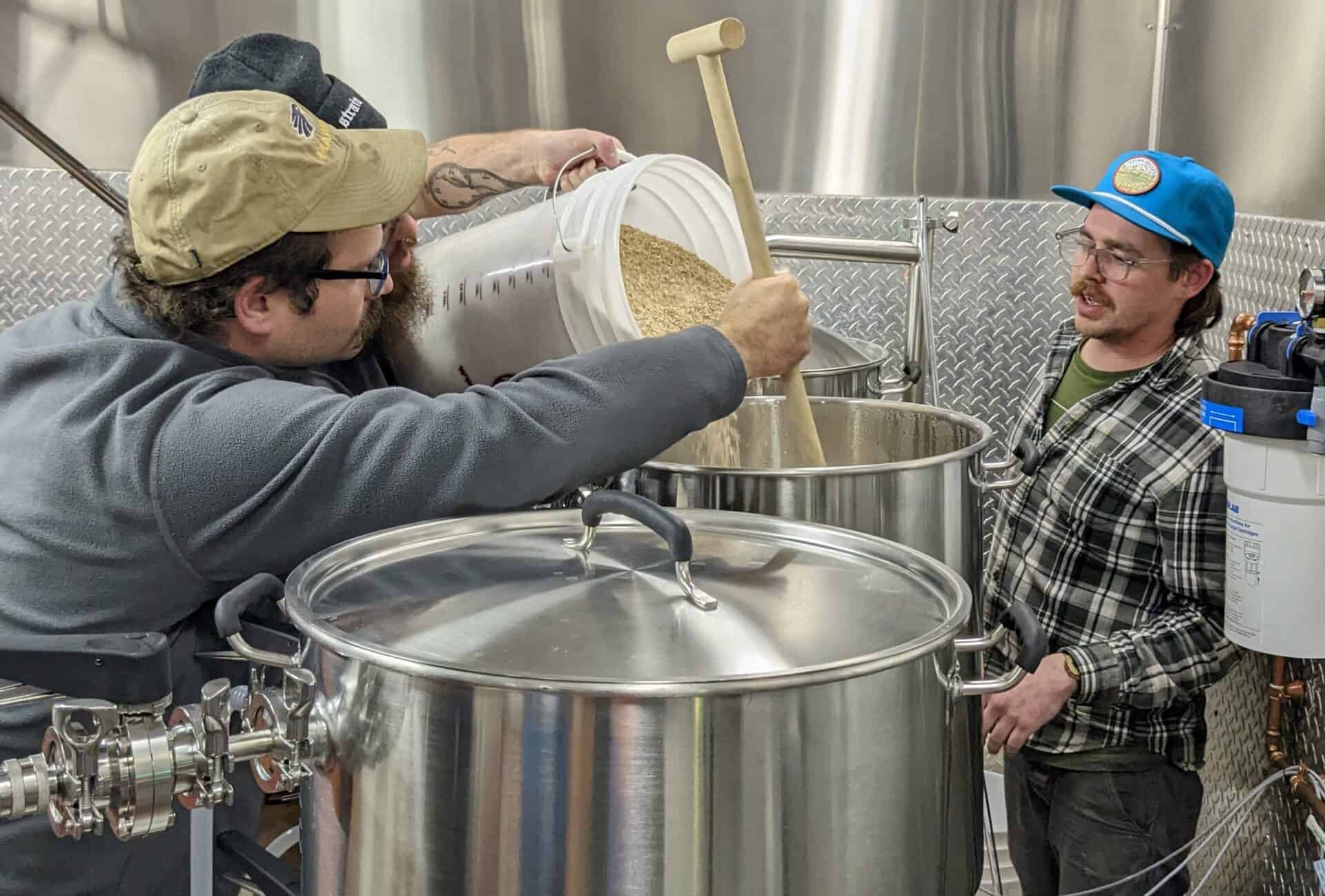 Brewing Science students Matthew Poblenz and Eric Herzog (in back) with Brewing Science instructor Brad Brooks (right) (Photo from Ohio on Tap)