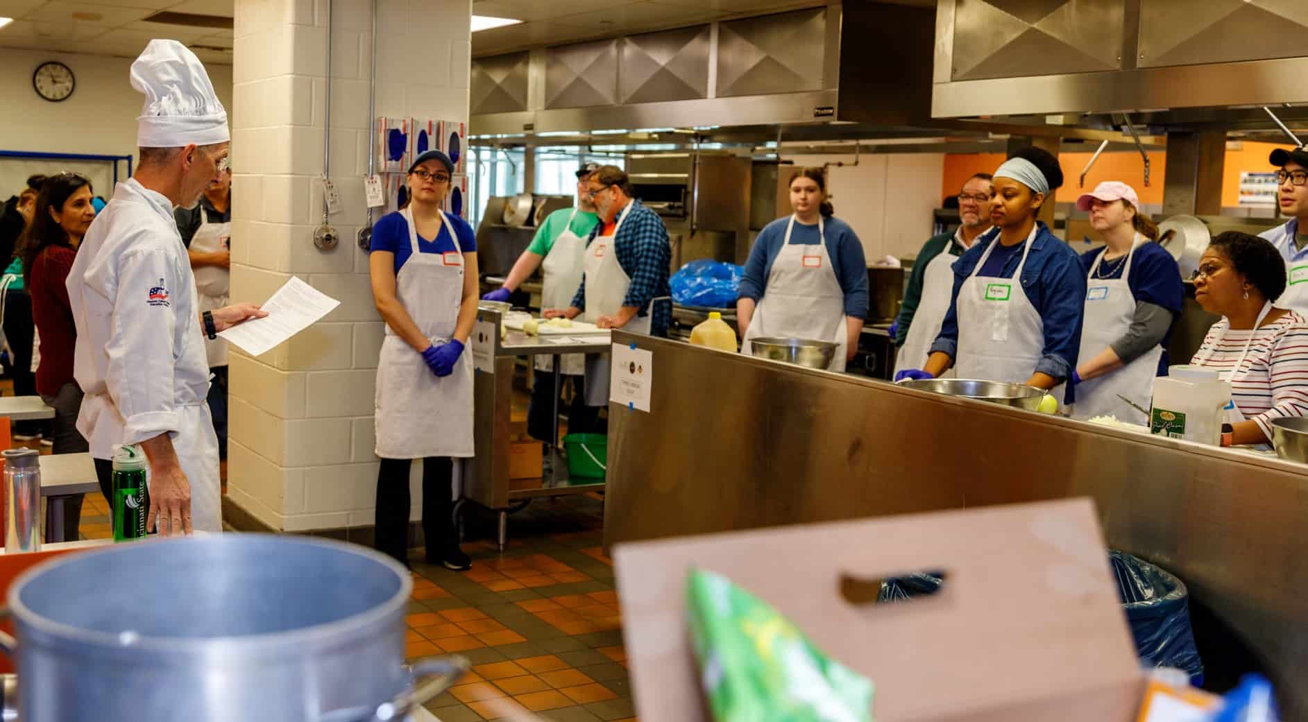 Chef Lee Ransdell gives instructions to the volunteers