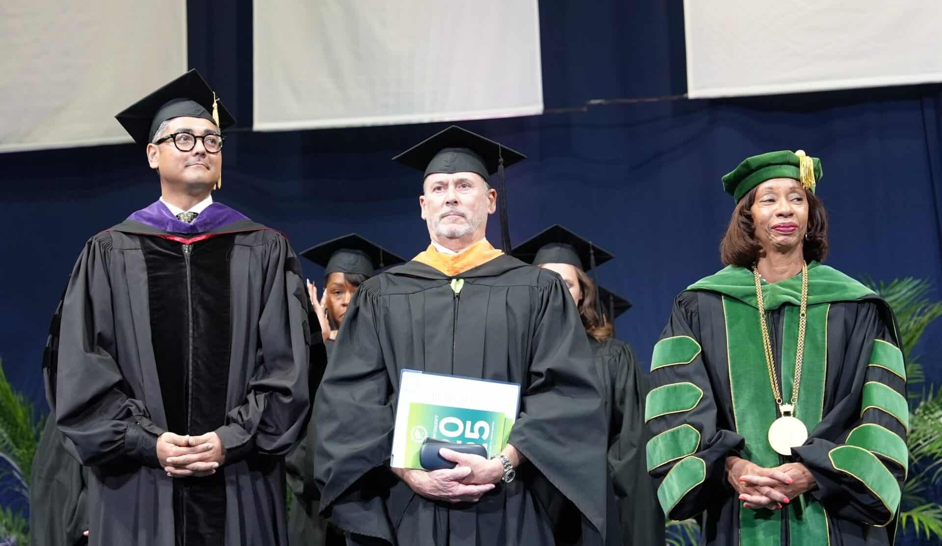 Mayor Aftab Pureval, BOT Chair John Silverman & Pres. Monica Posey at Commencement