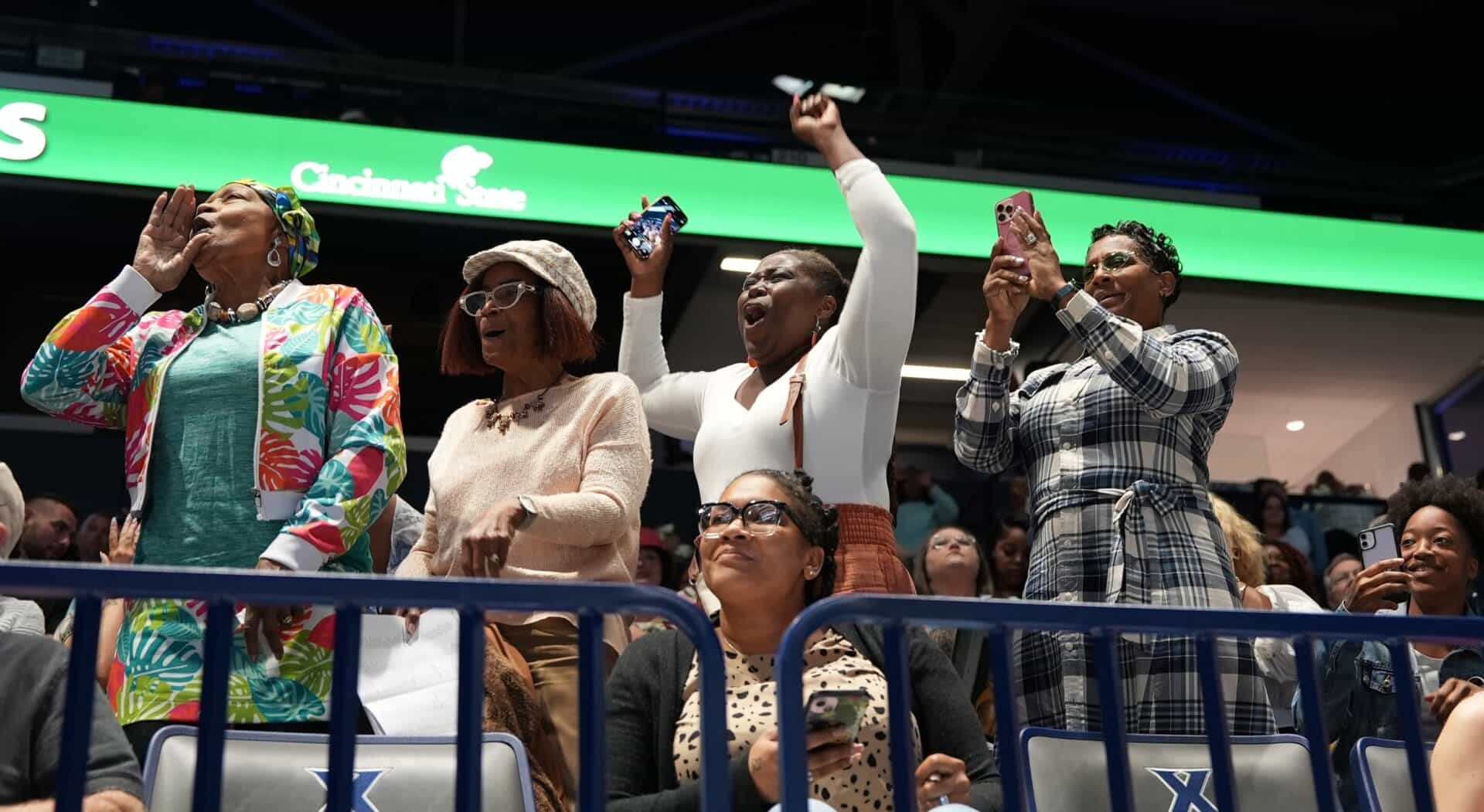 Family members cheering for the graduates at Commencement