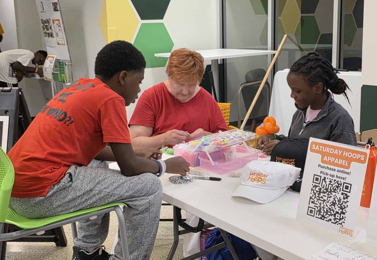 Making beaded bracelets at the CYC Back to School event at Cincinnati State