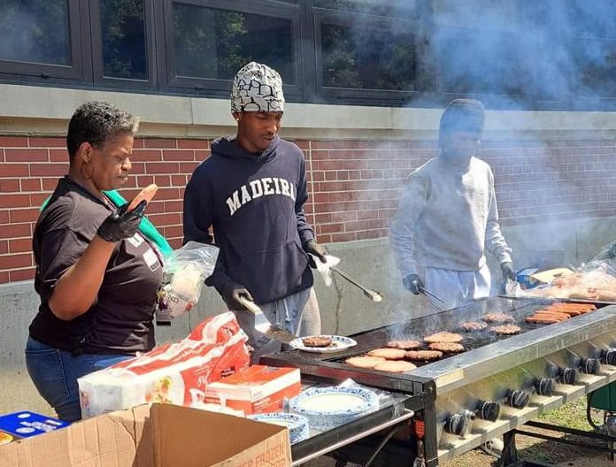 Volunteers grilling lunch at the CYC Back to School event at Cincinnati State