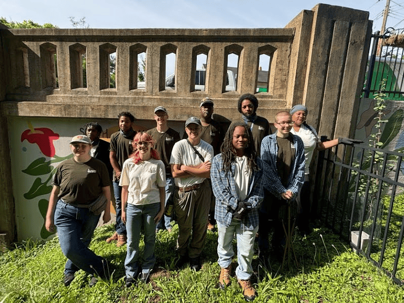 A group of people standing outside