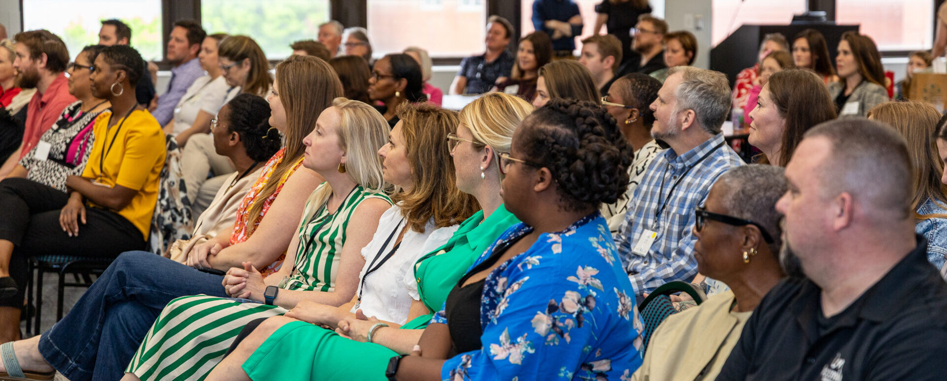 an audience of people at a networking event